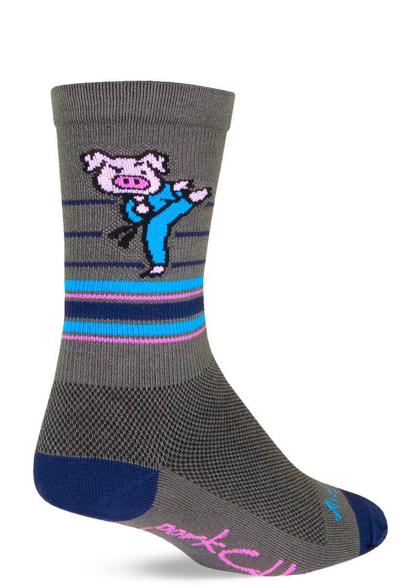 Funny athletic socks show a cartoon pig doing karate with the word "Porkchop" on the bottom of the foot.