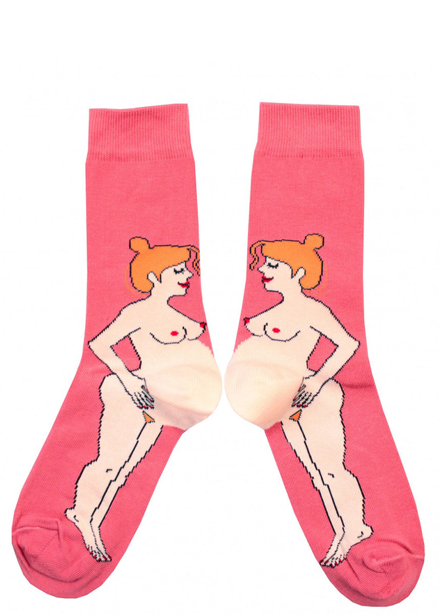 Funny pregnancy socks feature a nude pregnant redhead woman whose bulging belly is the heel of the socks.
