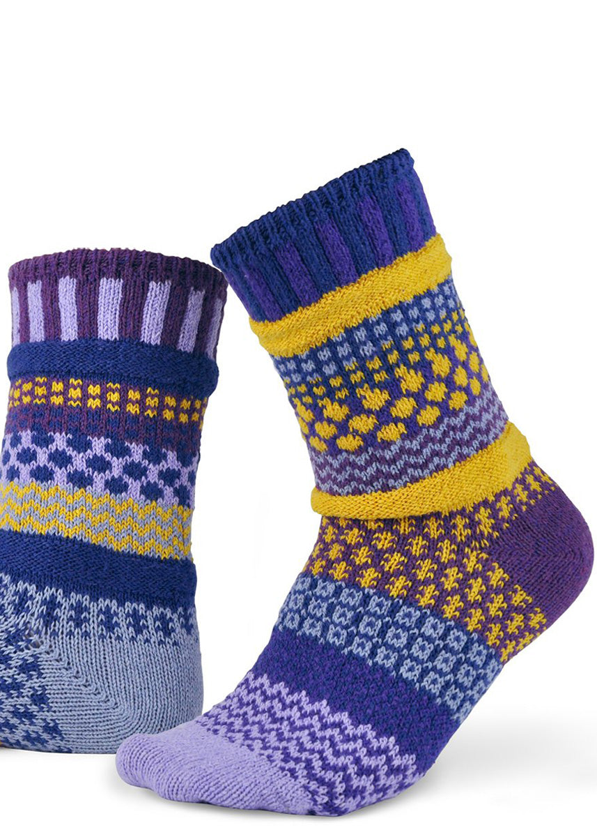 Mismatched socks feature funky patterns in bands of purples and yellows!