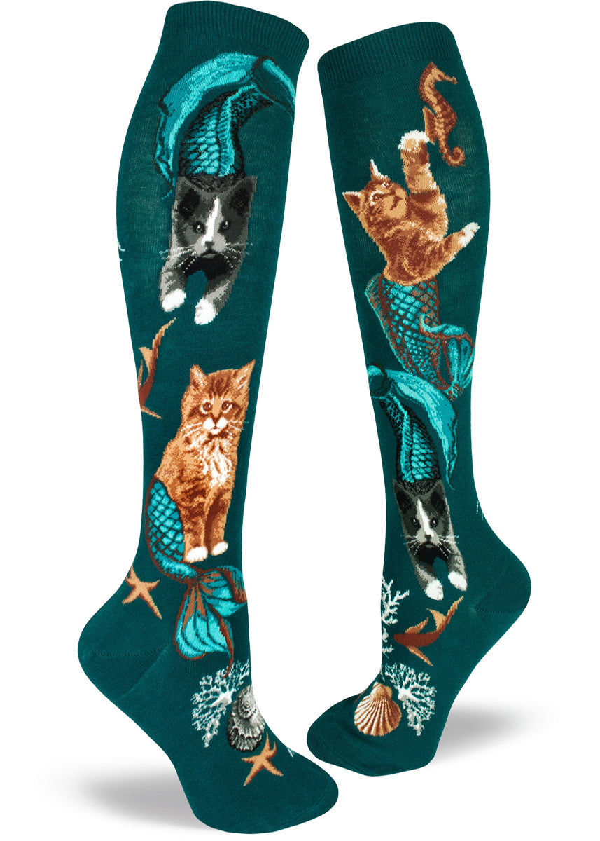 Knee-high purrmaid socks for women with cat mermaids swimming under the ocean on a deep teal background