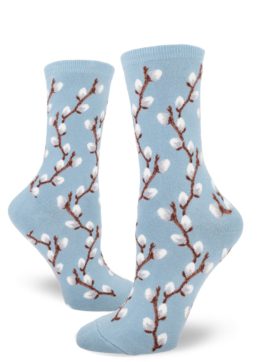 Light blue crew socks with a pattern of pussy willow branches winding up the length.