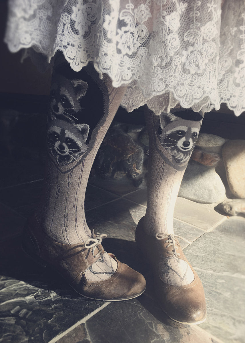 Knee-high raccoon socks for women with cute raccoons in tree dens, formed by the tree bark pattern socks
