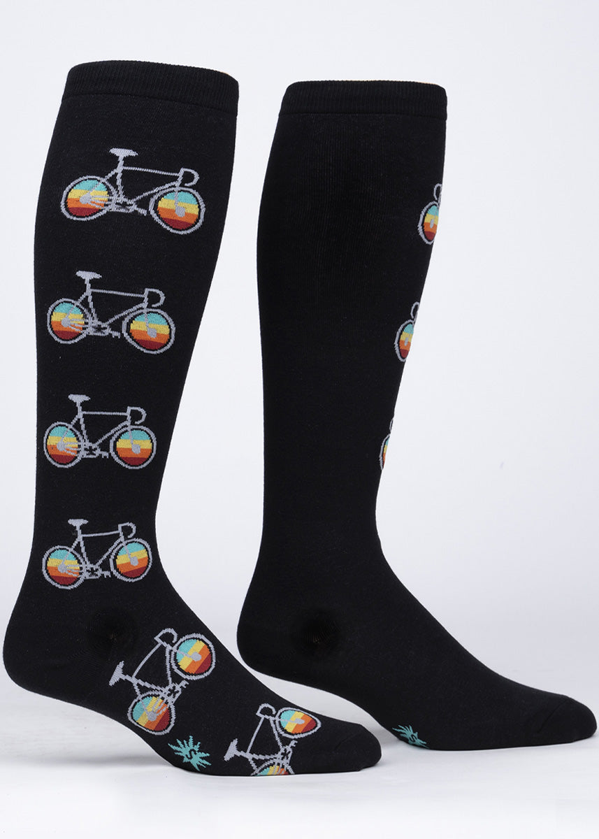Extra-stretchy knee high socks for women feature light gray bicycles with rainbow spokes!