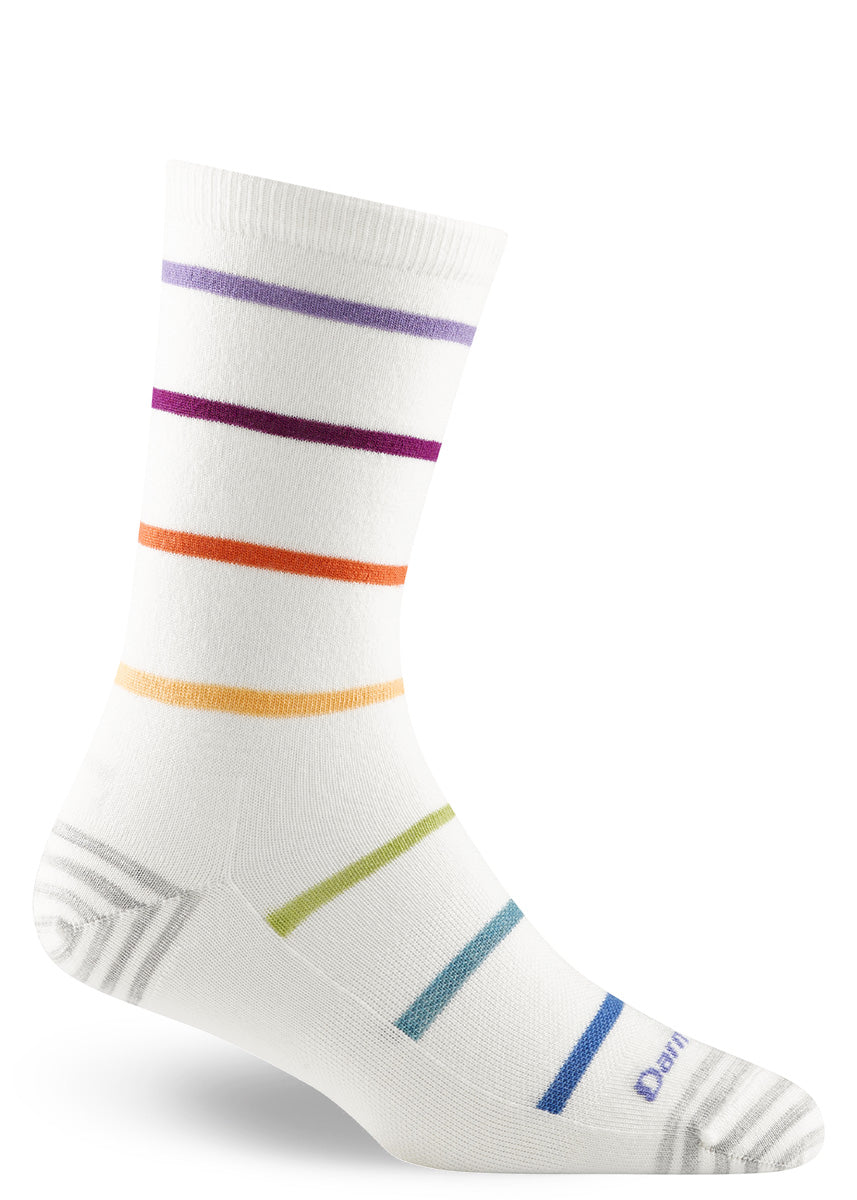 Wool socks featuring simple stripes in bold rainbow colors against a crisp white background.