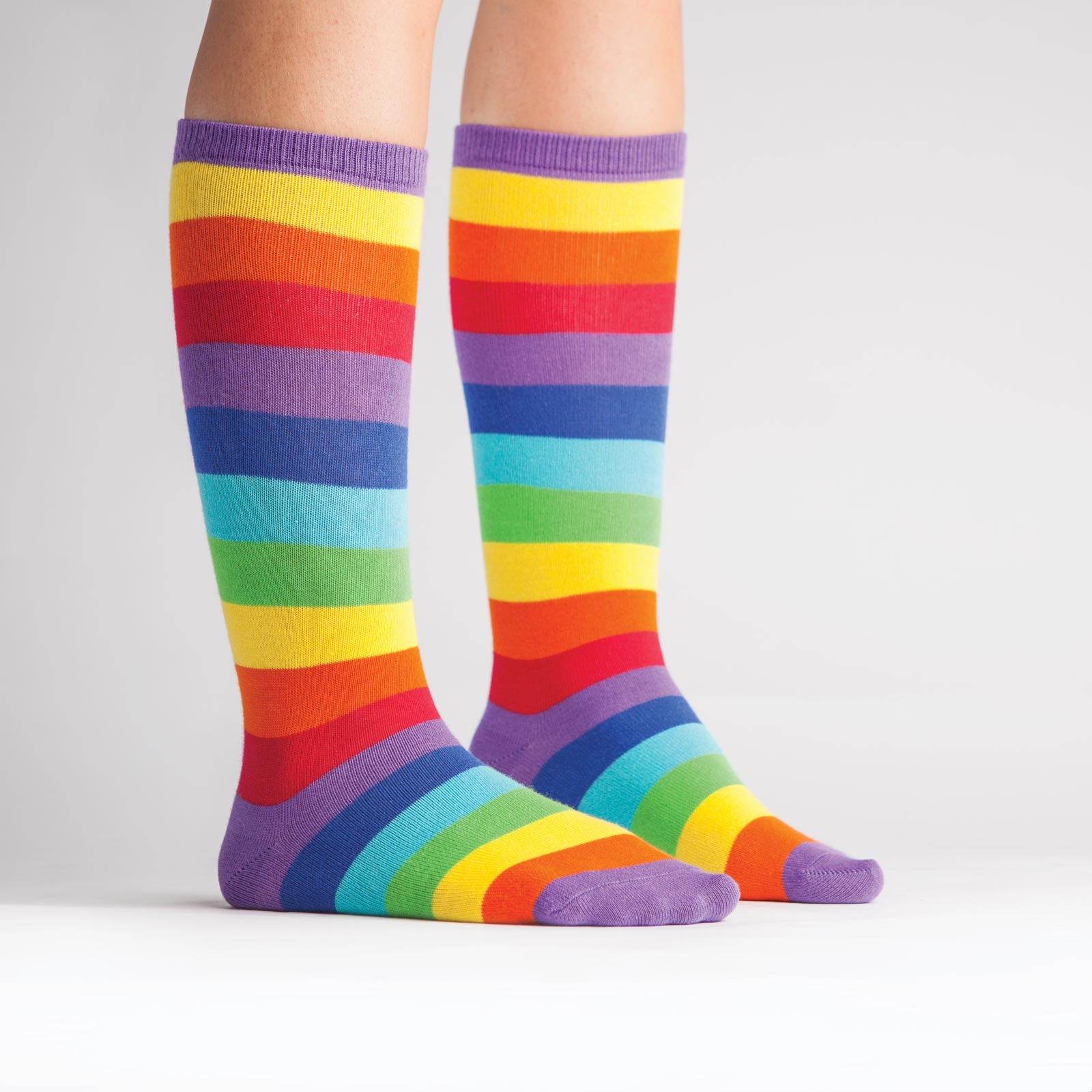 Brighten any rainy day with these rainbow striped knee-high socks for kids!