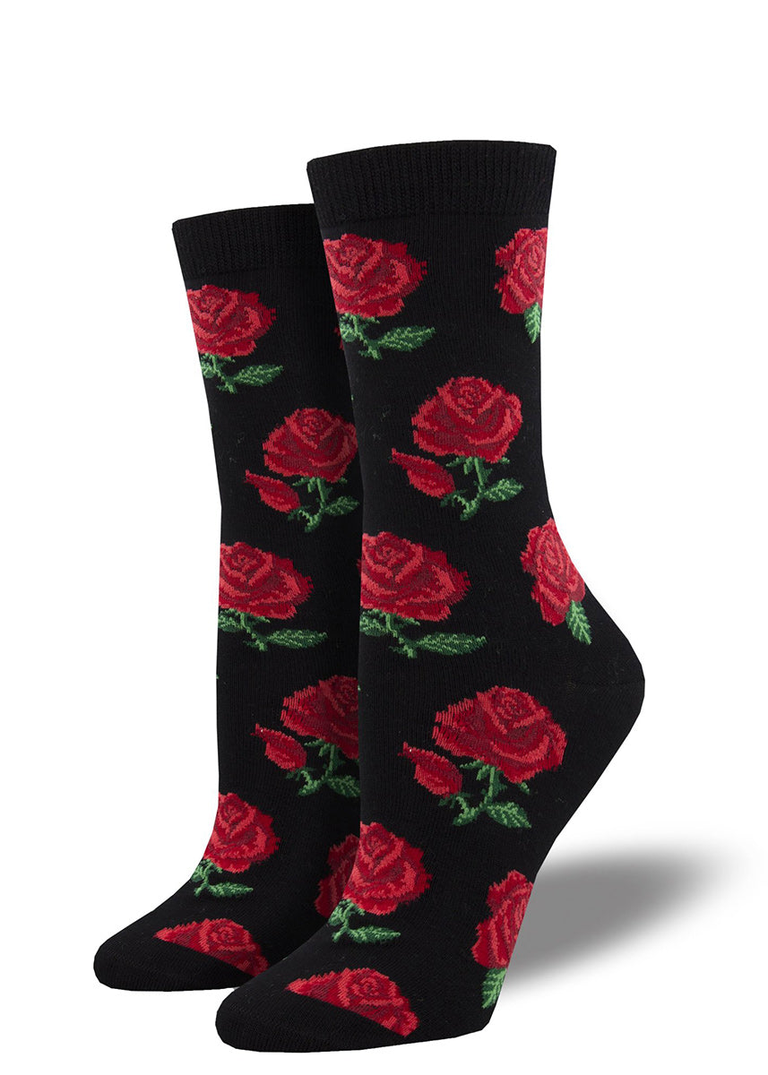 Crew socks for women are made of super-soft bamboo and feature a design of realistic red roses on a black background.