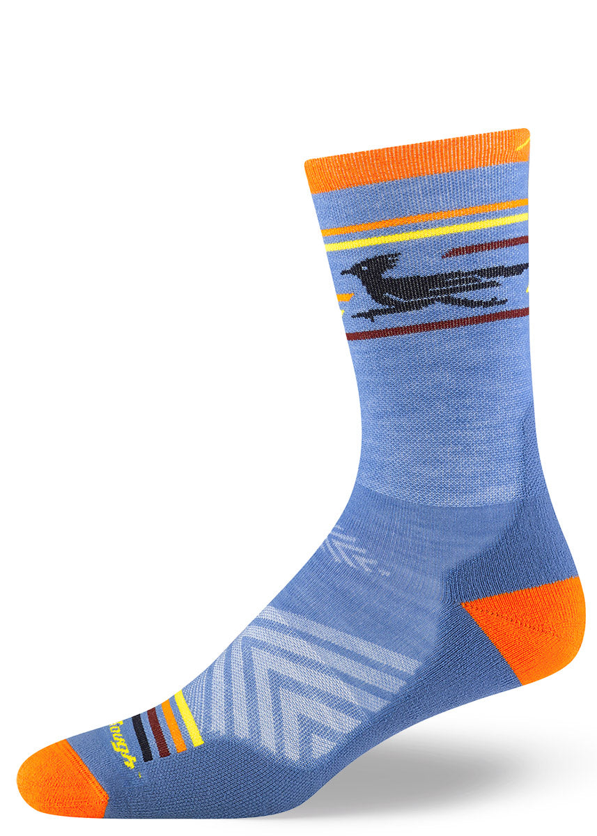 Blue wool running socks for men with a pattern around the cuff depicting a striped desert sunset and a speeding roadrunner bird.