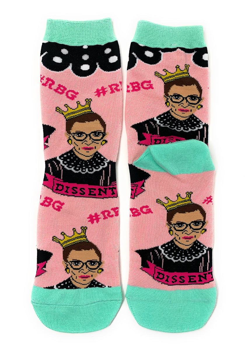 Ruth Bader Ginsburg socks feature Notorious RBG wearing a crown on a pink background and the word &quot;Dissent.&quot;