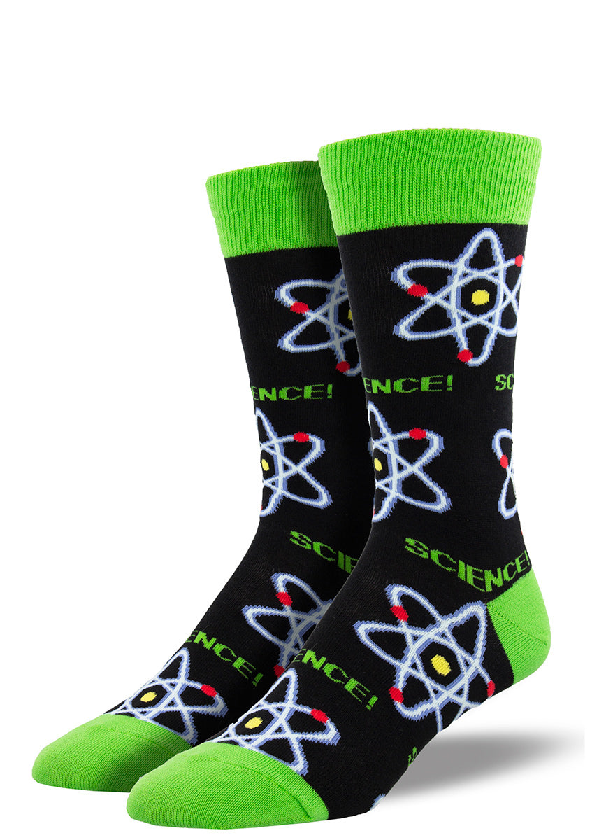 Crew socks for men feature atomic symbols and the word &quot;Science!&quot; on a black background with bright green accents.