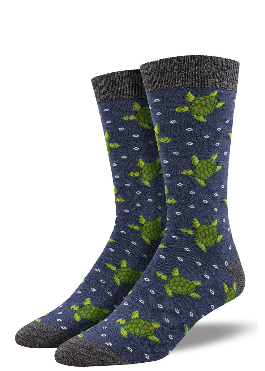 Bamboo crew socks for men feature green sea turtles swimming in a heather blue ocean!