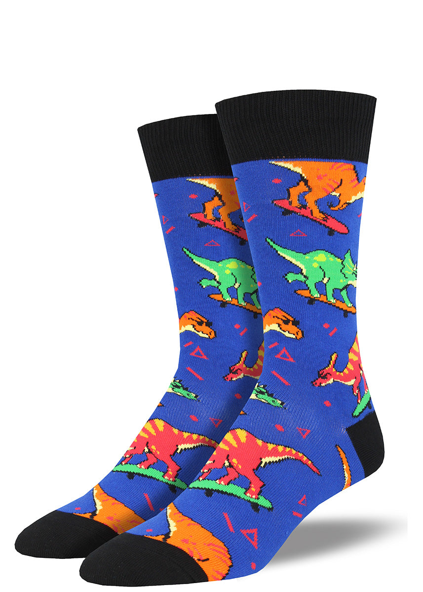Cool dinosaurs ride skateboards on these men&#39;s dinosaur socks with &#39;90s flair.