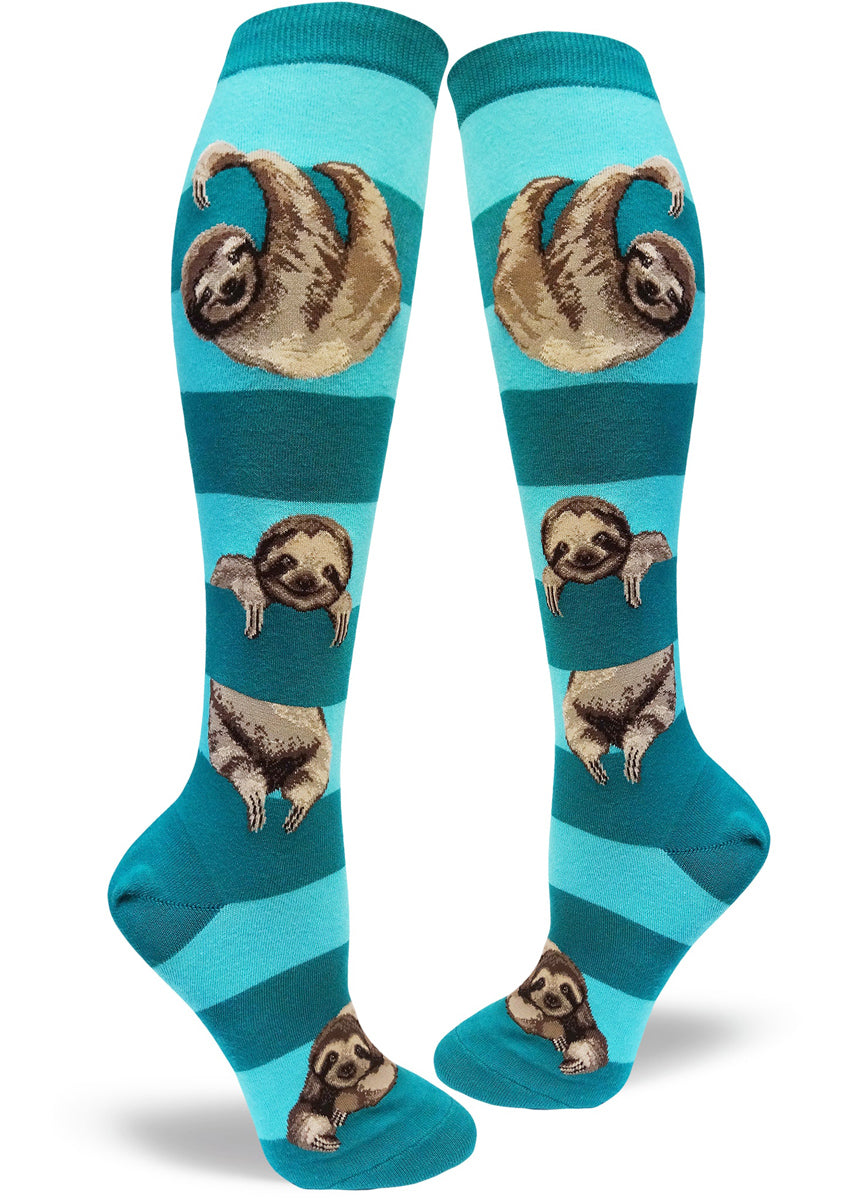 Cute knee-high sloth socks for women with sloths hanging between navy and white stripes