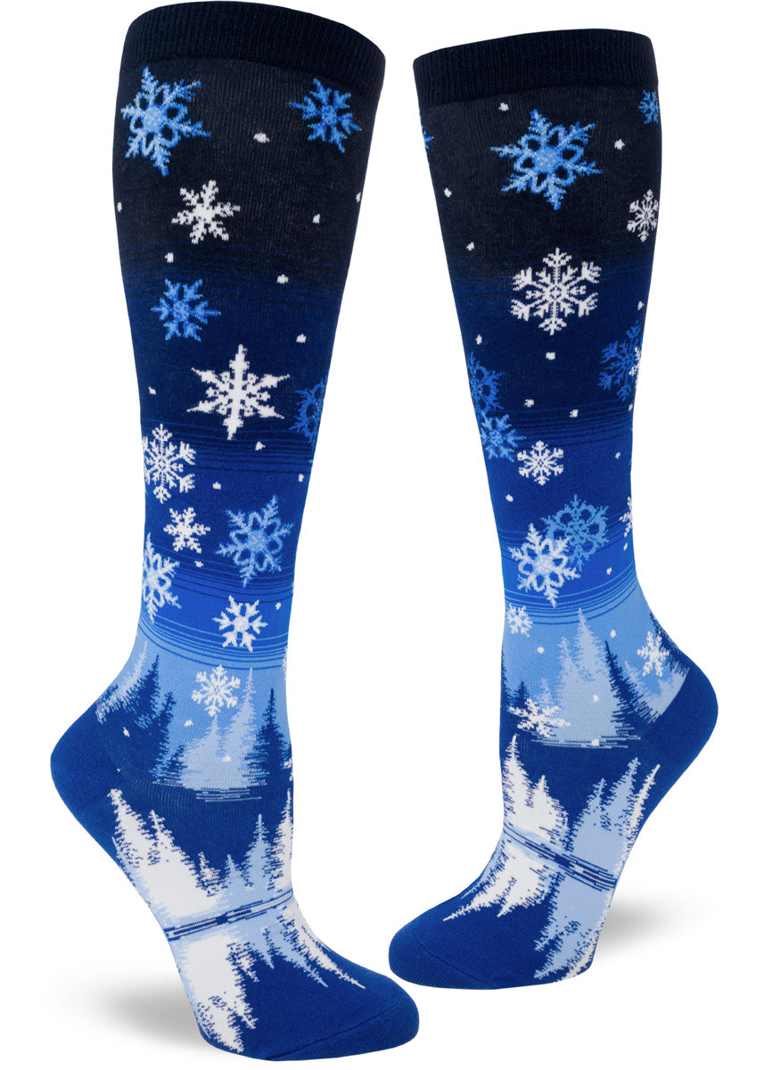 Snowflake knee-high socks for women with night sky full of snow and snowy trees