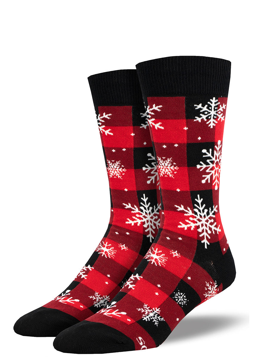 Christmas socks for men feature a snowflake design against a red-and-black plaid buffalo check background.