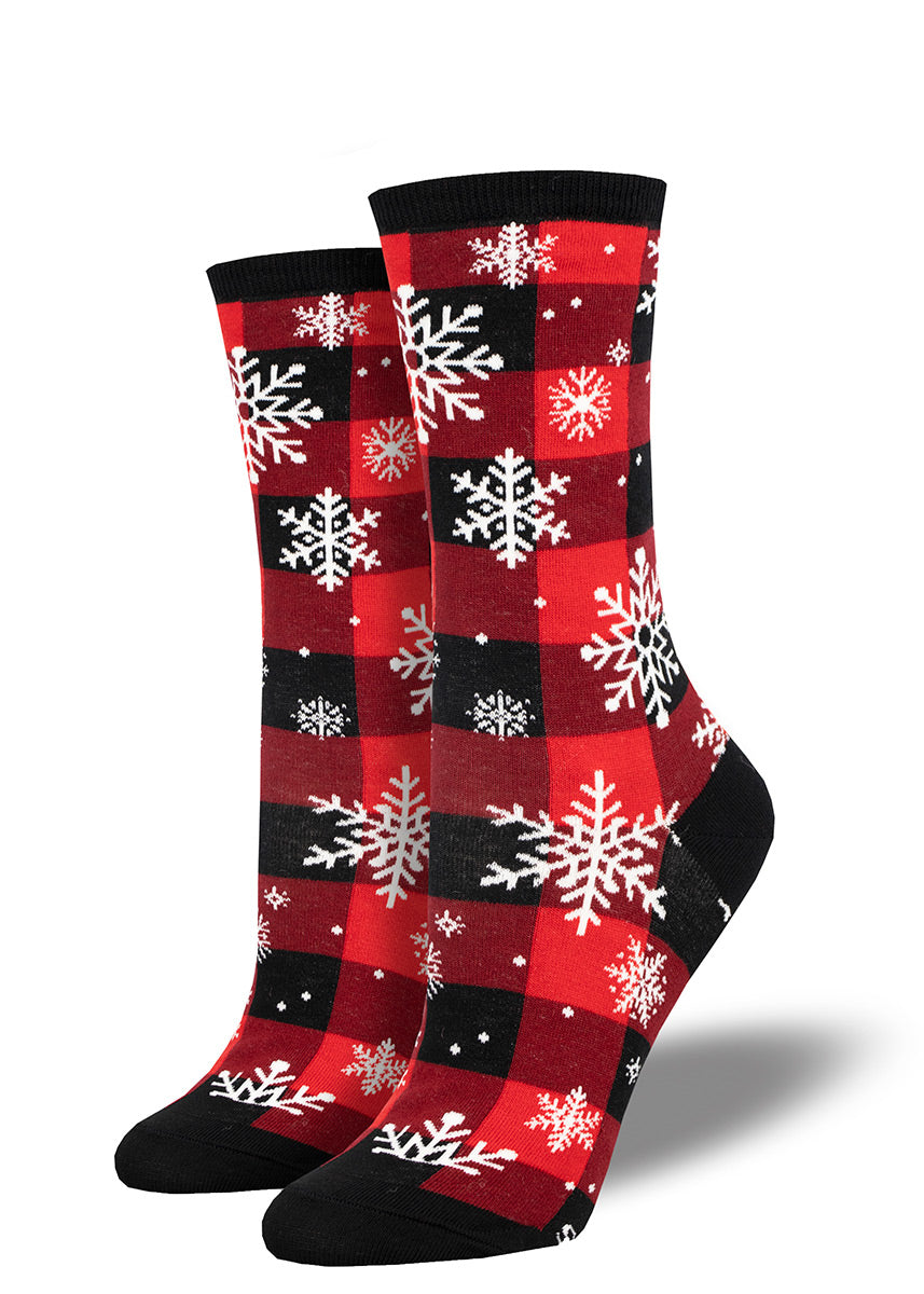 Christmas socks for women feature a snowflake design against a red-and-black plaid buffalo check background.
