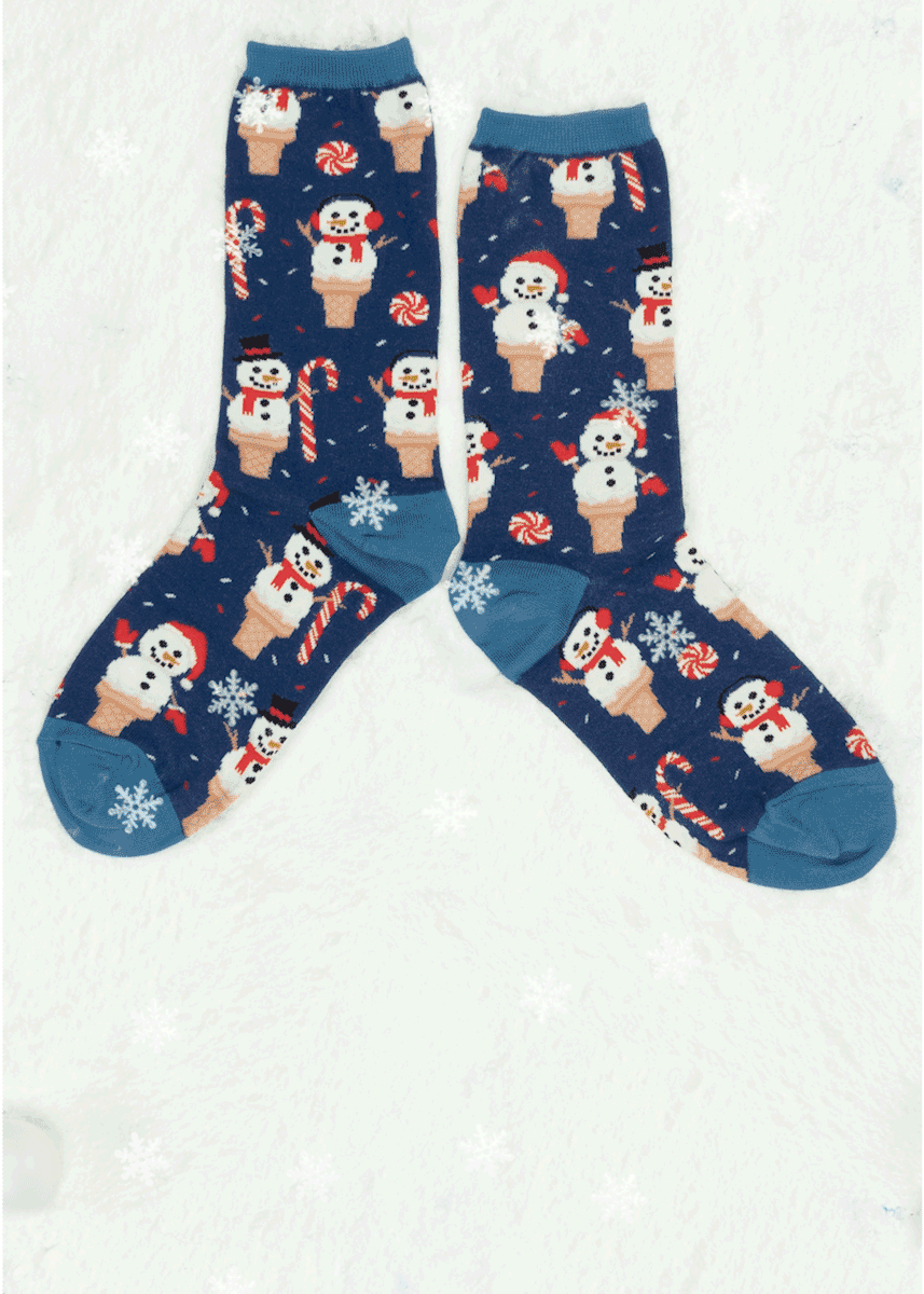 A gif of a pair of snowman and ice cream cone novelty socks features snowflakes falling and a cartoon snowman forming.