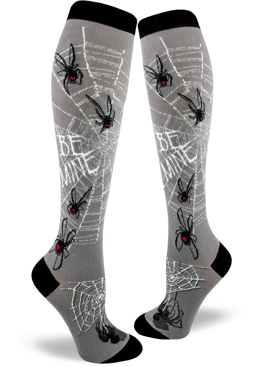 Spider knee socks for women with spiderwebs and black widow spiders with hearts on their abdomens spelling romantic messages in their webs