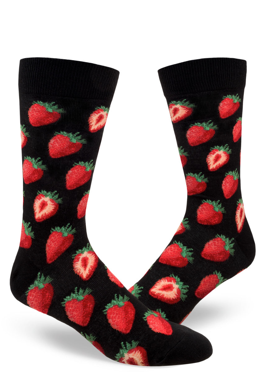 Black crew socks for men covered in whole and halved strawberries.