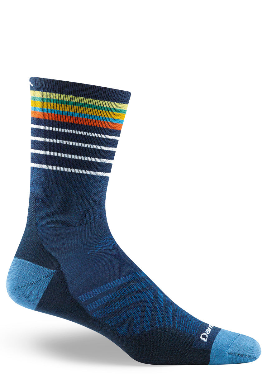 Wool socks for men feature a dark blue design with multicolor striped cuffs.