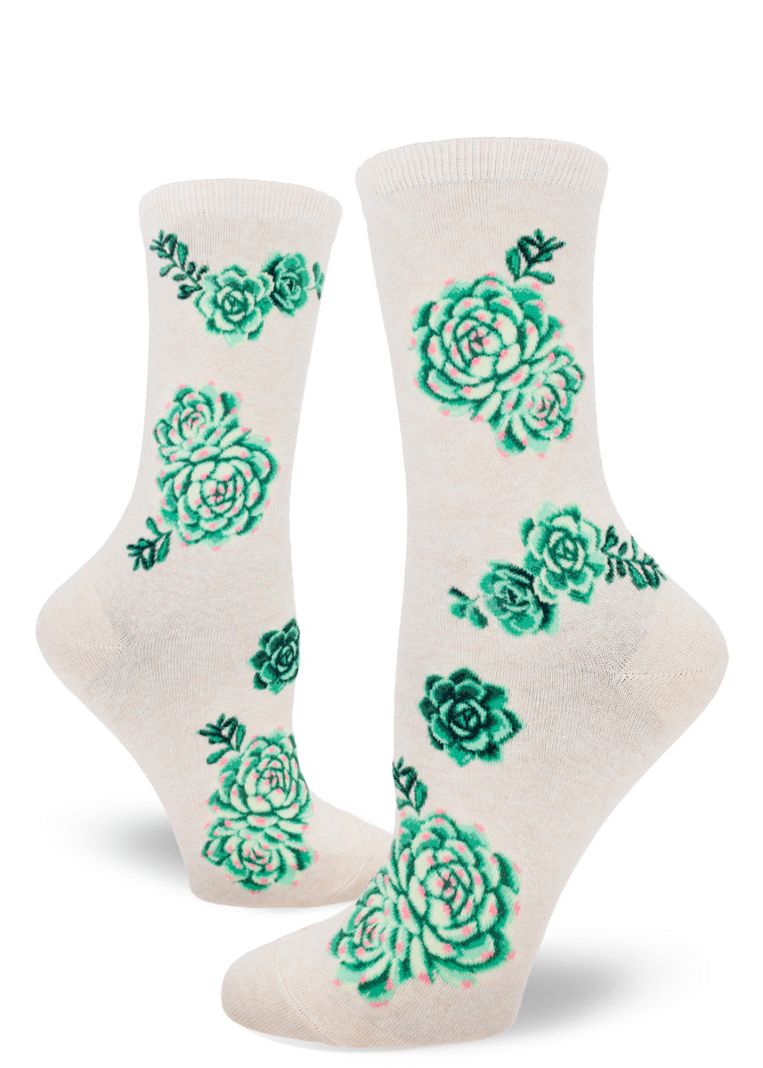 Pink crew socks with a pattern of green succulent plants.