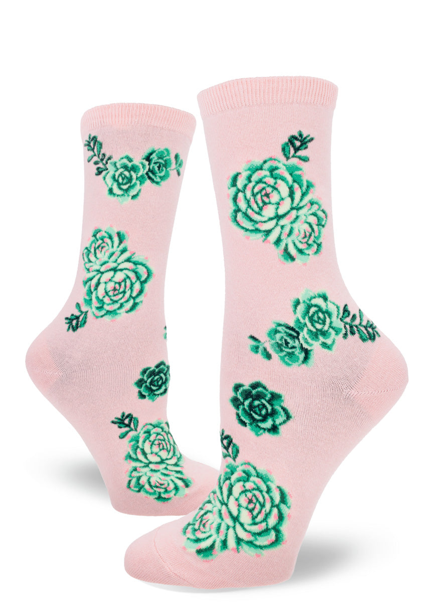 Pink crew socks with a pattern of green succulent plants.