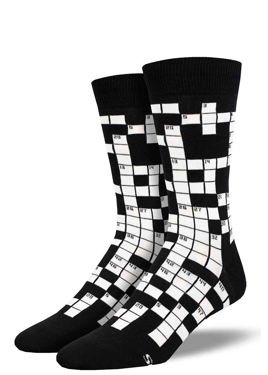 Novelty crew socks for men covered in black and white squares to resemble a crossword puzzle.