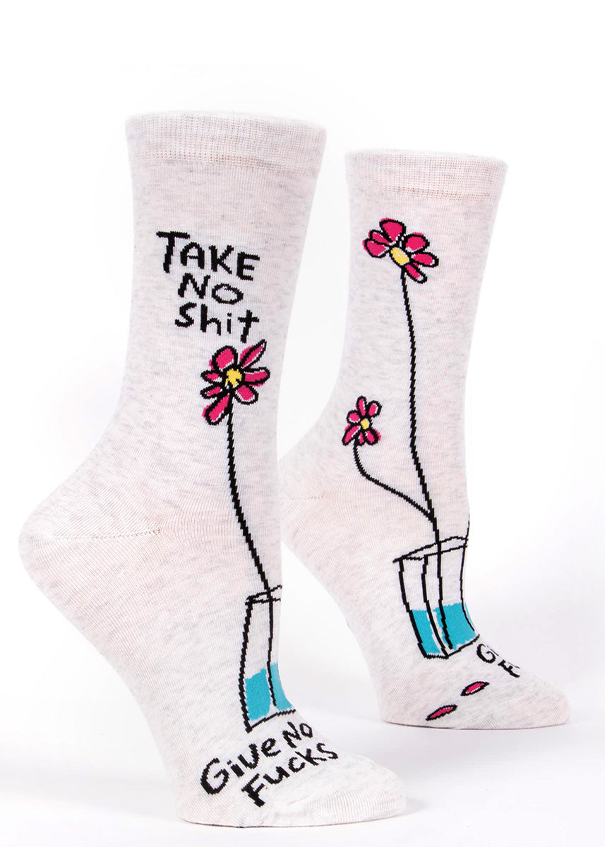 Women's swear word socks with a single flower and the words, "TAKE NO SHIT, GIVE NO FUCKS."