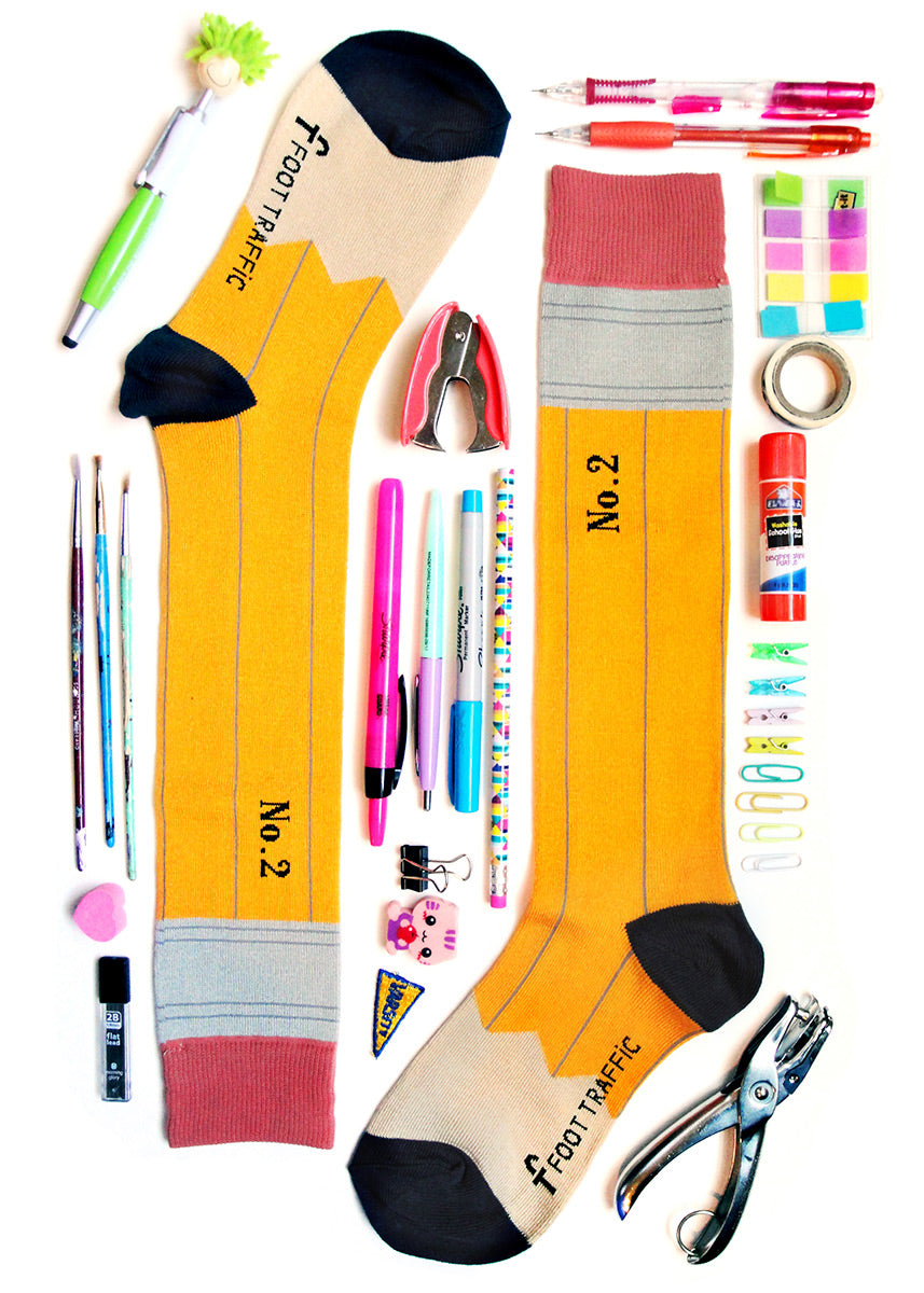 Teacher-themed knee-high socks that make your legs look like two no. 2 pencils, perfect for test-taking!