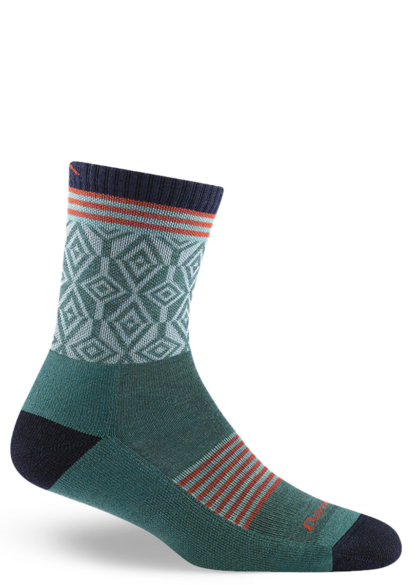 Lightly-cushioned wool socks for women feature funky geometric patterns and thin stripes in dark teal, sky blue, red, and navy.