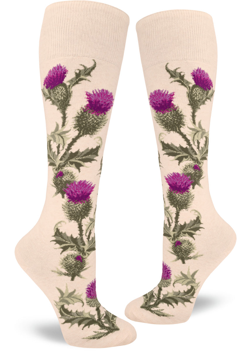 Knee-high thistle socks for women with thistle flowers and leaves on a cream background