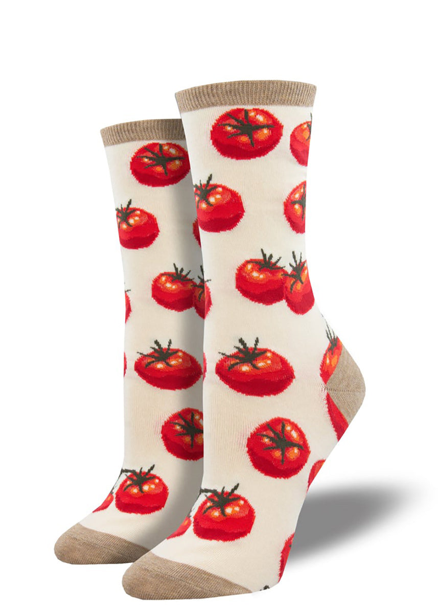 Ivory novelty socks covered in a pattern of red tomatoes.