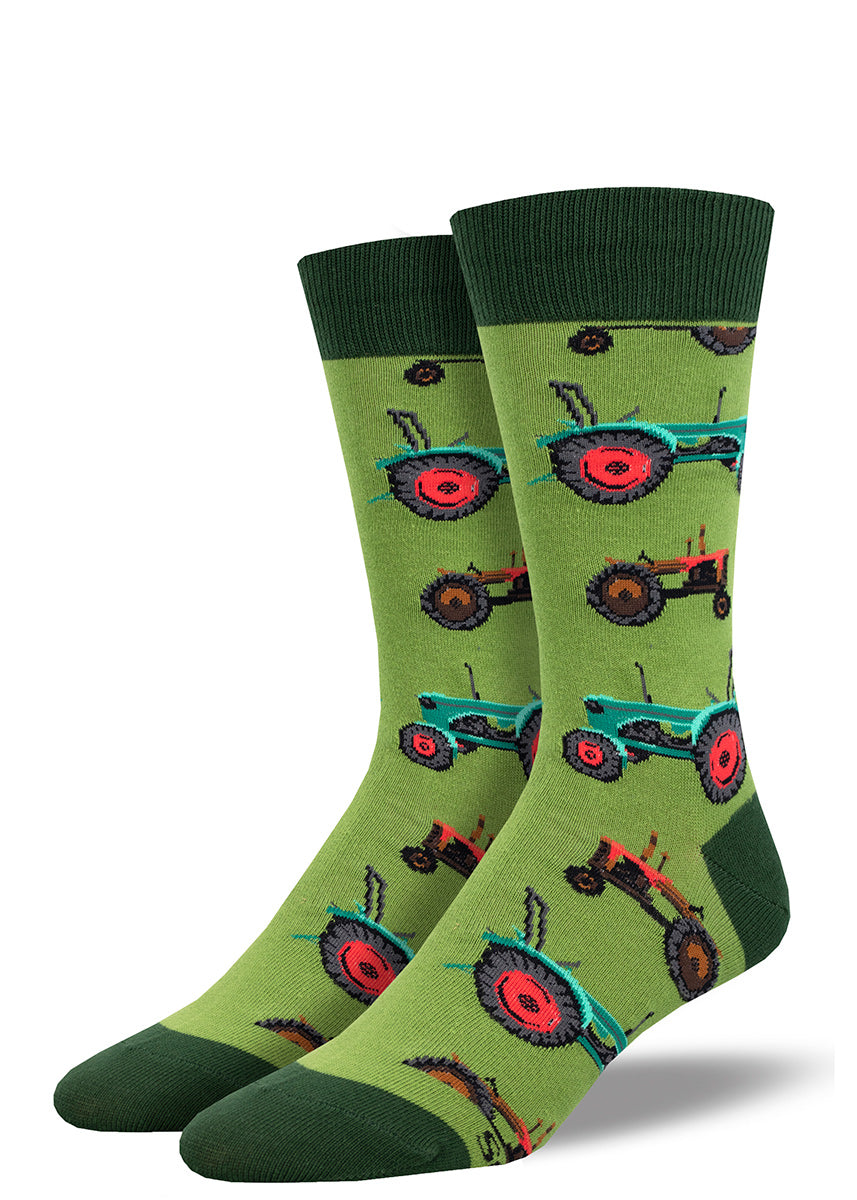 Green socks with a repeating pattern of red and green tractors and dark green accents at the heel, toe and cuff.