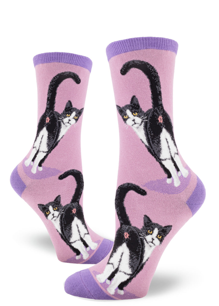 Mauve women's crew socks with a design of tuxedo cats inviting you to peek at their butts.