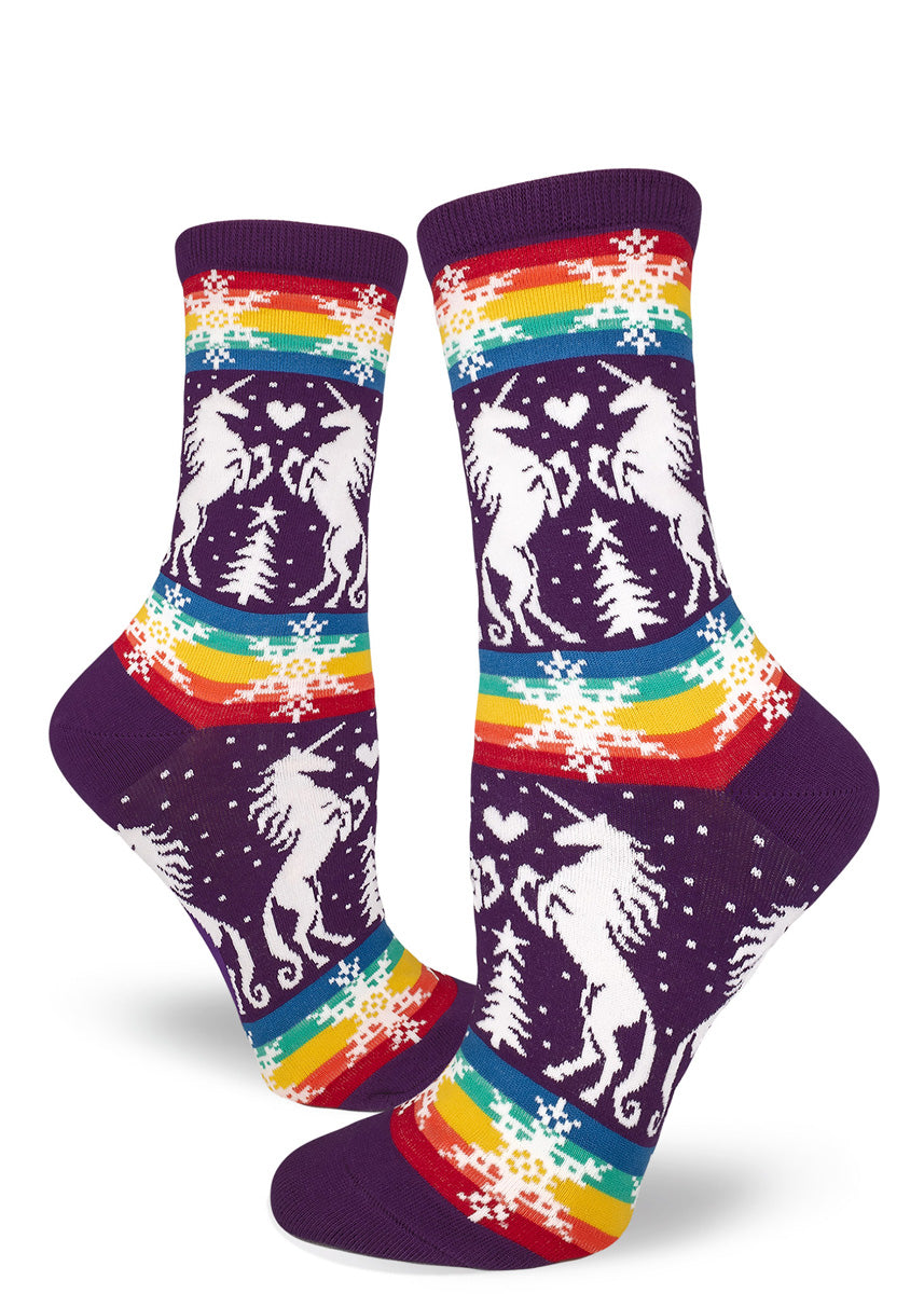 Funny gay Christmas socks for women with unicorns and rainbows on a purple background.