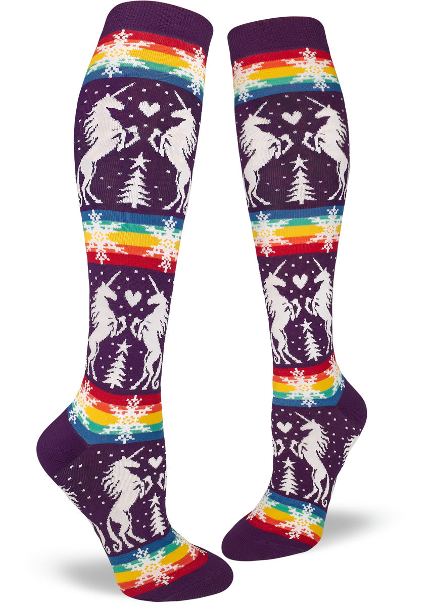 Christmas unicorn socks with rainbow pride flag stripes and snowflakes.