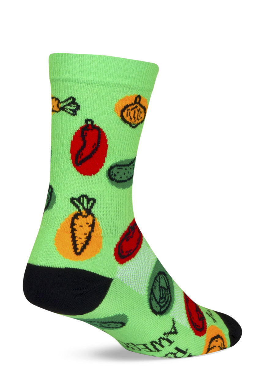 Cute athletic socks feature vegetables like carrots, peppers, cucumbers, tomatoes, and corn on a lime green background. 