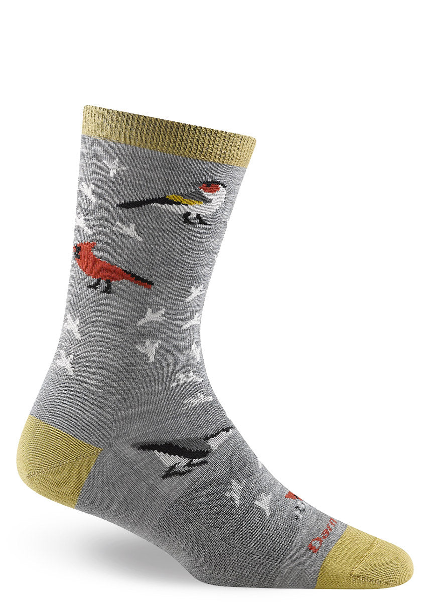Gray wool crew socks with various birds and bird footprints on them, accented in an earthy gold at the heel, toe and cuff.
