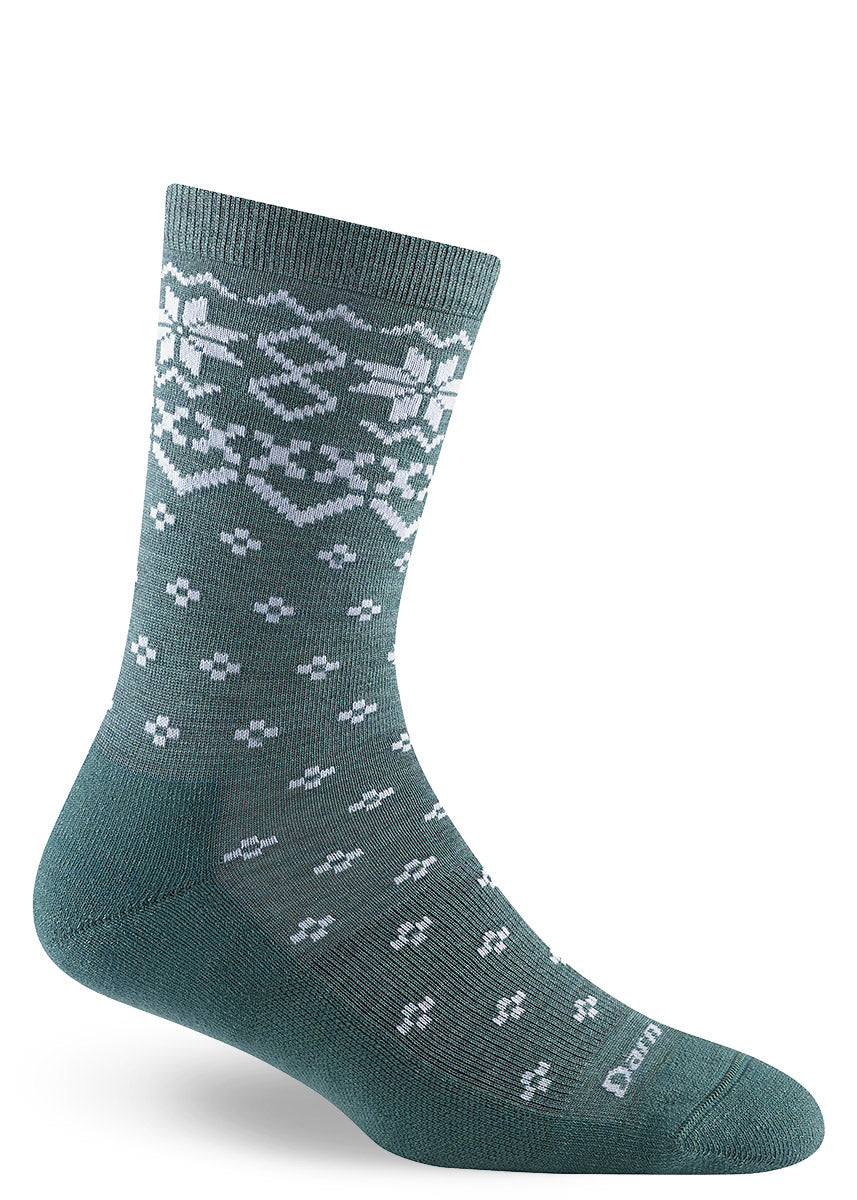 Teal wool crew socks with white snowflake designs throughout inspired by the knitting patterns of the Scottish Isles.