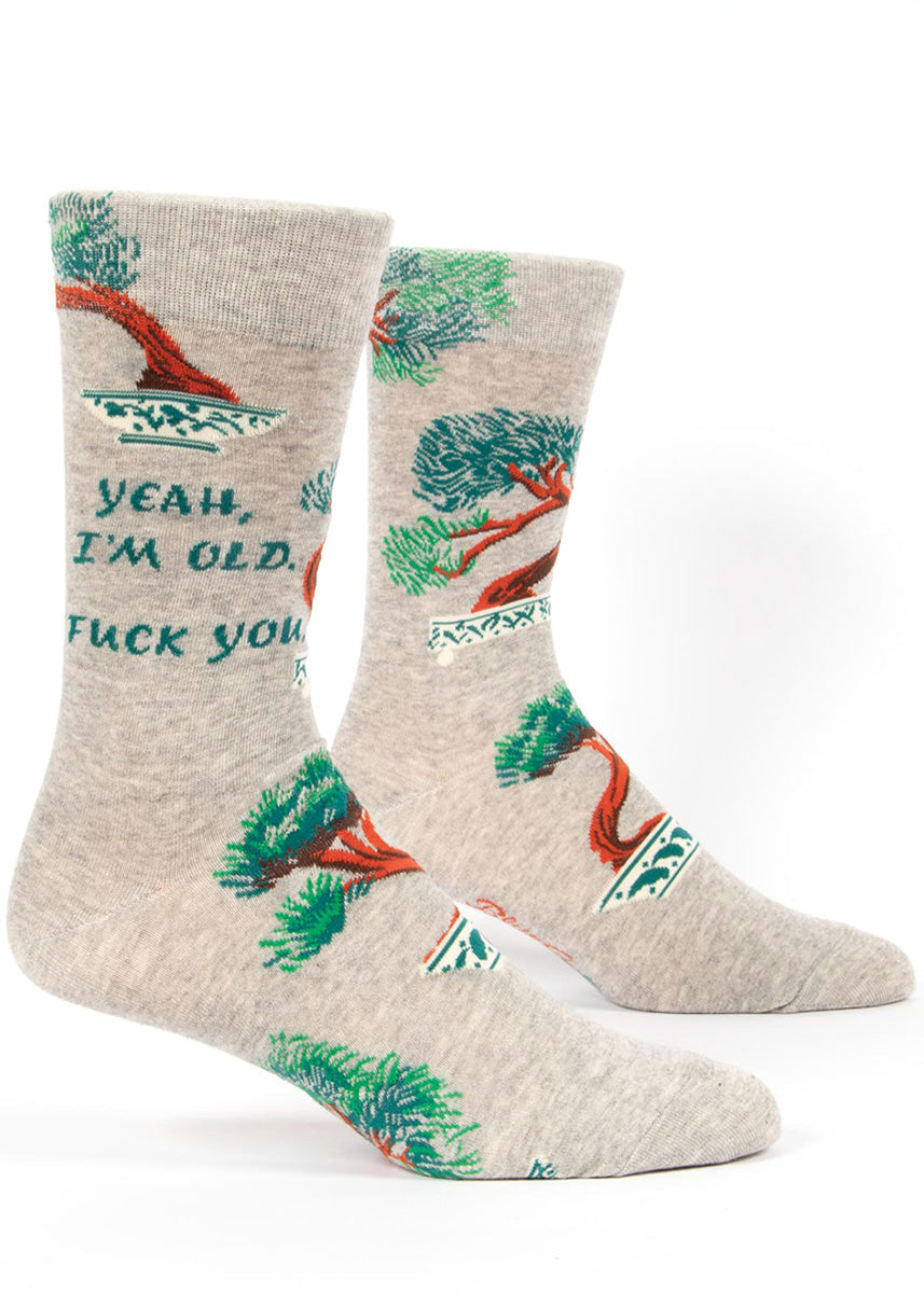 Funny socks for men with bonsai trees and the words, "Yeah, I'm old. Fuck you."
