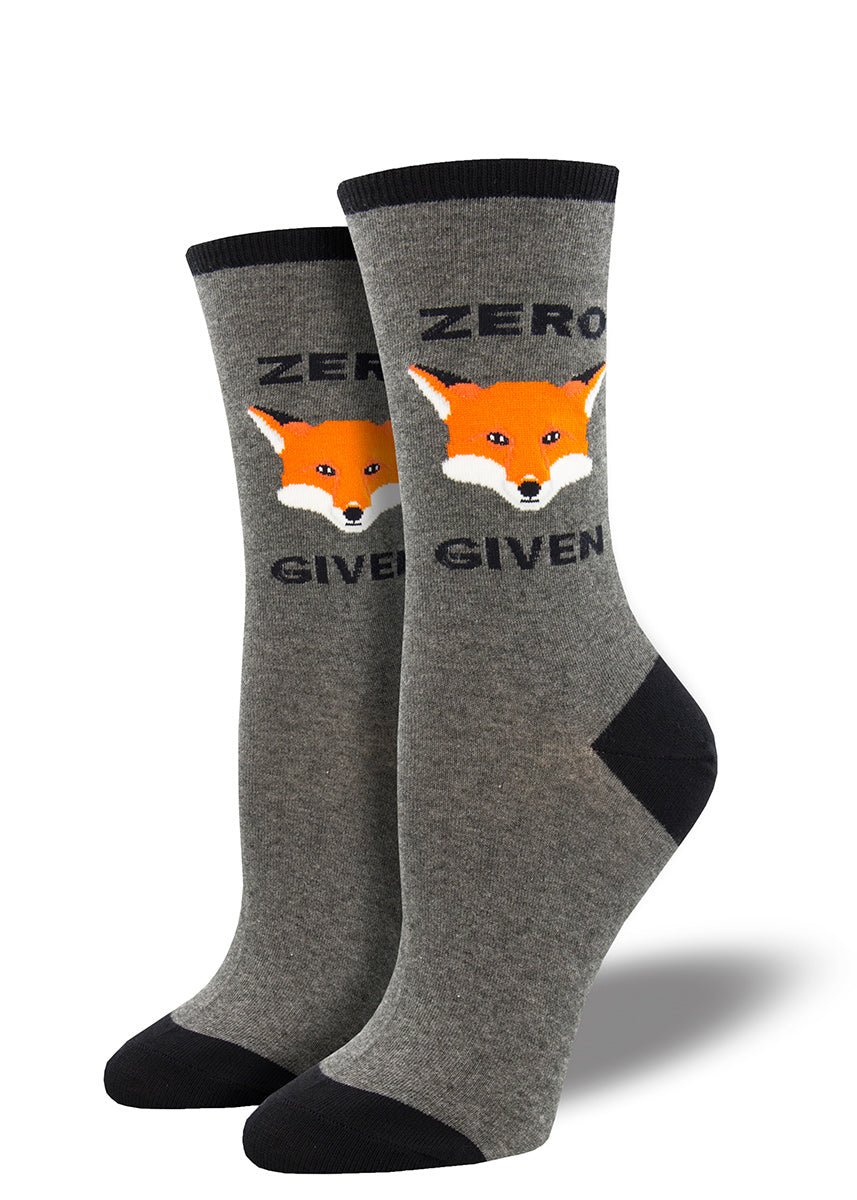 Crew socks for women use a fox face to spell out &quot;Zero Fox Given&quot; on a gray background.